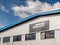 Northampton UK March 16 2018: The Automated Technology Group A Wood Group Mustang Company logo banner on warehouse wall