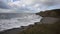 Northcott Mouth beach north of Bude North Cornwall England UK south west cast path with waves pan