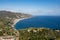 Northeastern landscape of Taormina city, Sicily with a coastline, blue sea and Letojanni town