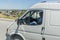 NORTHERN AZERBAIJAN - JUNE 22, 2018: Van driver with his foot on a dashboard driving in Azerbaija