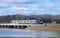 Northern dmu leaving Arnside Viaduct April 2022