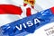 Northern Ireland Visa in passport. USA immigration Visa for Northern Ireland citizens focusing on word VISA. Travel Northern