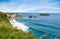 Northern Irish coastline in Carrick-a-rede in Ballycastle. scenic landscape of grass hillsides, rock cliffs and still waves