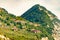 Northern Italian architecture, private houses, hotels and other buildings built high on the rocky mountain on the edge of a cliff