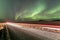 Northern light above the road in Norway A quite road in Scandinavia with a spectacular Northern Light Aurora display lighting