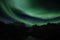 Northern lights abobe Mt. Stjerntindene in Flakstad island, Lofoten