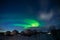 Northern Lights also known as aurora, borealis or polar lights at cold night over igloo village. Beautiful night photo