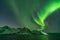 Northern lights, Aurora Borealis, with the Husfjellet mountain, Tungeneset, Senja, Norway