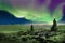 Northern Lights or Aurora Borealis, Iceland and cairn stone piles