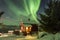 Northern lights Aurora Borealis in the night above a typically a