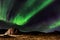 Northern lights, Aurora Borealis in the night sky, Iceland. These colourful curtains of dancing lights can illuminate the night
