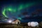 Northern lights Aurora borealis over farm house in Gardur town