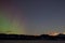 Northern lights (aurora borealis) and rising moon