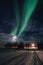 Northern lights, Aurora Borealis with starry in the night sky over Flakstad church in Lofoten Islands