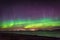 Northern lights aurora at seaside color and beams Norway