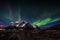 Northern lights hovering above Mt. Stornappstinden in Flakstad island, Lofoten