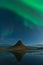 Northern lights in Iceland. Landscape full of kp5 Aurora Borealis. Amazing nightscape at Kirkjufell, scenic travel destination. Gr