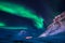 Northern lights in the mountains house of Svalbard, Longyearbyen city, Spitsbergen, Norway wallpaper