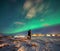 Northern Lights in the mountains of Reine, Norway. Lofoten Islands