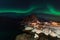 Northern lights over the Hamnoy village at night in winter season, Lofoten islands, Norway