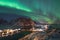 Northern lights over the Hamnoy village at night in winter season, Lofoten islands, Norway