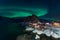 Northern lights over the Hamnoy village at night in winter season, Lofoten islands, Norway