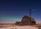 Northern Lights over vintage barn, bins and windmill in Saskatchewan