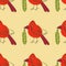 Northern red cardinal bird with christmas pickle in beak seamless pattern. New year print for tee, paper, fabric, textile.