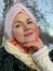 Northern Woman with a scarf on her head, cold north, Siberian weather. Red cheeks from the cold.