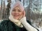 Northern Woman with a scarf on her head, cold north, Siberian weather. Red cheeks from the cold.