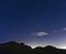 Northumberland night sky over Northumberlandia with stars, cloud and light pollution