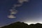 Northumberland night sky over Northumberlandia with stars, cloud and light pollution