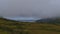 Northwestern coast of AndÃ¸ya island, VesterÃ¥len in northern Norway near village Bleik with mountains vanishing in clouds.