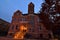 Northwestern University old main zwemer hall at dusk with orange leaves in the streetlight