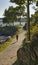 A norvegian girl jogging in nature surrounded by ocean and trees in Stavanger city