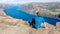 Norway - Boy sitting on a steep cliff with the view on Lysefjorden