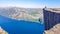 Norway - Boy sitting on a steep cliff with the view on Lysefjorden