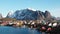 Norway. Breathtaking view of high mountain rocky peaks covered with white snow. Panoramic landscape of Lofoten fjords in