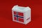Norway flag on white box with barcode and the color of nation flag on red background. The concept of export trading from Norway