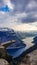 Norway - A girl sittinging at the edge of Trolltunga