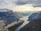 Norway - A girl standning at the edge of Trolltunga