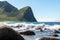 Norway Lofoten fjords - waves splash on stones on the ocean coast