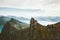 Norway mountaineering travel man standing on cliff mountain top