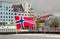 Norway national flag waving in norwegian city Bergen, Scandinavia, scandinavian Europe nordic town travel european cityscape fjord