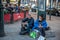 Norway, Oslo August 01 2013. Two elderly men ask for alms, sitting on the street in front of the cafe. The concept of