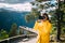 Norway. Young Adult Caucasian Woman Lady Tourist Traveler Photographer Taking Pictures Photos Near Stegastein Viewpoint