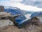 Norway - Young man sitting at the edge of Trolltunga