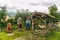 Norwegian carved wooden sculptures of trolls and a reindeer on a background of mountains in the misty morning. Scandinavian folklo