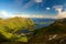 Norwegian coast mountains above bay with islets in wonderful sunlight, Lofoten, Norway