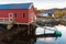 Norwegian fishing village, red wooden barn on coast